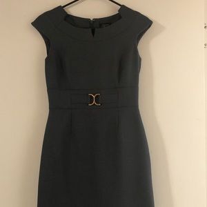 Almost new. The dress has a nice gray color.